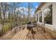 Spacious outdoor deck with a wood plank surface and patio furniture; wooded views abound at 4000 Wieuca Rd Ne, Atlanta, GA 30342