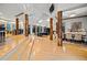 An expansive living room features hardwood floors, exposed beams and pillars, and plenty of natural light at 4000 Wieuca Rd Ne, Atlanta, GA 30342