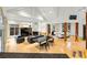 A spacious living room has hardwood floors, a fireplace, and high ceilings with lots of natural light at 4000 Wieuca Rd Ne, Atlanta, GA 30342
