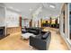 A modern living room features a fireplace, hardwood floors, and high ceilings with lots of natural light at 4000 Wieuca Rd Ne, Atlanta, GA 30342