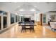 Bright living room with high ceilings, fireplace, hardwood floors, and access to the outdoor deck at 4000 Wieuca Rd Ne, Atlanta, GA 30342