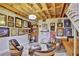 Finished basement with a unique aesthetic including hardwood floors, wood beams, and custom furniture at 7030 Cascade Palmetto Hwy, Palmetto, GA 30268