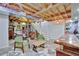 A finished basement space with eclectic decor, stairs, and a wooden bar is ideal for entertainment at 7030 Cascade Palmetto Hwy, Palmetto, GA 30268