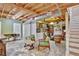 Spacious finished basement area perfect for entertaining, featuring wood beams and an eclectic aesthetic at 7030 Cascade Palmetto Hwy, Palmetto, GA 30268