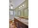 Well-lit bathroom with double sinks, granite countertops, and modern fixtures for a spa-like experience at 7030 Cascade Palmetto Hwy, Palmetto, GA 30268