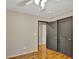 Neutral bedroom with luxury vinyl flooring, closet and natural light, creating a serene and comfortable space at 7030 Cascade Palmetto Hwy, Palmetto, GA 30268