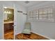 Functional secondary bedroom with laminate floors adjacent to en-suite bathroom and plenty of natural light at 7030 Cascade Palmetto Hwy, Palmetto, GA 30268
