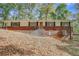 Charming brick home with classic design and well-maintained landscaping in a tranquil neighborhood at 7030 Cascade Palmetto Hwy, Palmetto, GA 30268