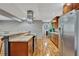 This open kitchen features stainless steel appliances, plenty of cabinet space, and hardwood floors at 7030 Cascade Palmetto Hwy, Palmetto, GA 30268