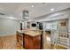 Open concept kitchen boasts stainless steel appliances, hardwood floors, and granite countertops at 7030 Cascade Palmetto Hwy, Palmetto, GA 30268