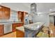 Kitchen featuring an island with seating, stainless steel appliances, and cabinets at 7030 Cascade Palmetto Hwy, Palmetto, GA 30268