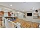 Open-concept living room with wood floors, natural light and kitchen featuring an island with seating at 7030 Cascade Palmetto Hwy, Palmetto, GA 30268