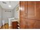 Convenient laundry room featuring granite countertops, wash basin, storage cabinets, and a washer and dryer at 7030 Cascade Palmetto Hwy, Palmetto, GA 30268