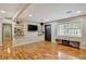 Living room featuring wood floors, media console, and natural light at 7030 Cascade Palmetto Hwy, Palmetto, GA 30268