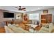Comfortable living room with hardwood floors and a brick accent wall, blending modern and rustic charm at 7030 Cascade Palmetto Hwy, Palmetto, GA 30268