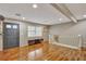 Open-concept living room with wood floors, natural light and stairs to the kitchen at 7030 Cascade Palmetto Hwy, Palmetto, GA 30268