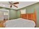 Relaxing main bedroom with hardwood floors and natural light, creating a serene and comfortable space at 7030 Cascade Palmetto Hwy, Palmetto, GA 30268