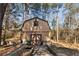 Barn in wooded area with large doors, perfect for storage and other rural activities at 28 East Boxwood Dr, Cartersville, GA 30121