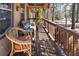 Relax on this covered front porch with wood flooring and a seating area at 28 East Boxwood Dr, Cartersville, GA 30121