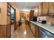 Kitchen with cabinets and countertops, stainless steel dishwasher and laundry in next room at 28 East Boxwood Dr, Cartersville, GA 30121