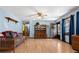 Comfortable living room featuring hardwood floors, natural light, and a vintage hutch at 28 East Boxwood Dr, Cartersville, GA 30121