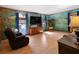 Inviting living room with mural, wood trim and hardwood flooring at 28 East Boxwood Dr, Cartersville, GA 30121