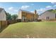 Expansive backyard with lush green grass and a charming home exterior at 3004 Westray Nw Ct, Marietta, GA 30064