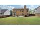 Spacious backyard with mature trees, patio area, and swing set at 3004 Westray Nw Ct, Marietta, GA 30064