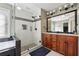 Modern bathroom with a walk-in shower, soaker tub, and double vanity at 3004 Westray Nw Ct, Marietta, GA 30064