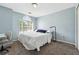 Comfortable bedroom with neutral walls, cozy carpet, and a window at 3004 Westray Nw Ct, Marietta, GA 30064