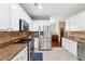 Modern kitchen with stainless steel appliances, granite countertops, and white cabinets at 3004 Westray Nw Ct, Marietta, GA 30064