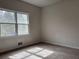 Bedroom with natural light shining through windows and neutral colored carpet at 43 Thornbush Ct, Hiram, GA 30141