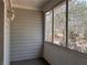 Enclosed screened porch boasts wooded view from three large picture windows at 43 Thornbush Ct, Hiram, GA 30141