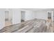 Finished basement with modern gray vinyl plank flooring and bright white walls at 4425 Cascade Sw Rd, Atlanta, GA 30331