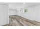 Finished basement with modern gray vinyl plank flooring and bright white walls at 4425 Cascade Sw Rd, Atlanta, GA 30331