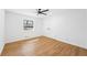 Bright bedroom with hardwood floors, a ceiling fan, a window, and a closet at 4425 Cascade Sw Rd, Atlanta, GA 30331