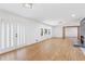 Bright living room with hardwood floors, a fireplace, and French doors to the outside at 4425 Cascade Sw Rd, Atlanta, GA 30331