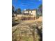 Expansive backyard featuring a large deck and a sunroom addition to the home at 5678 Fern Creek Sw Dr, Lilburn, GA 30047
