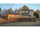 Large backyard with a spacious deck and well-maintained lawn at 5678 Fern Creek Sw Dr, Lilburn, GA 30047