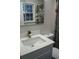 Bathroom vanity with integrated sink and modern faucet at 5678 Fern Creek Sw Dr, Lilburn, GA 30047