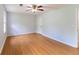 Bedroom featuring hardwood floors, neutral walls and a window for plenty of natural light at 5678 Fern Creek Sw Dr, Lilburn, GA 30047