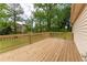 Spacious deck perfect for outdoor entertaining, overlooking a large, grassy backyard at 5678 Fern Creek Sw Dr, Lilburn, GA 30047