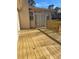 Spacious wood deck, perfect for outdoor gatherings, extending from the sunroom at 5678 Fern Creek Sw Dr, Lilburn, GA 30047
