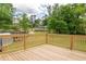 A wooden deck overlooks a well-maintained backyard at 5678 Fern Creek Sw Dr, Lilburn, GA 30047