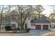 Charming two-story home with a two car garage and mature trees in a quiet neighborhood at 5678 Fern Creek Sw Dr, Lilburn, GA 30047