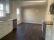 Bright kitchen with stainless steel appliances, modern white cabinets, and sleek countertops at 5678 Fern Creek Sw Dr, Lilburn, GA 30047