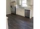 Bright kitchen showcasing stainless steel appliances, modern white cabinetry, and sleek countertops at 5678 Fern Creek Sw Dr, Lilburn, GA 30047