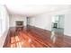 Spacious living room featuring hardwood floors, neutral walls, and abundant natural light at 5678 Fern Creek Sw Dr, Lilburn, GA 30047