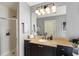 Modern bathroom with a glass-enclosed shower, granite countertop vanity, and contemporary design at 57 Forsyth Nw St # 5F, Atlanta, GA 30303