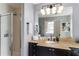 Bright bathroom boasts a walk-in shower and granite countertop vanity at 57 Forsyth Nw St # 5F, Atlanta, GA 30303